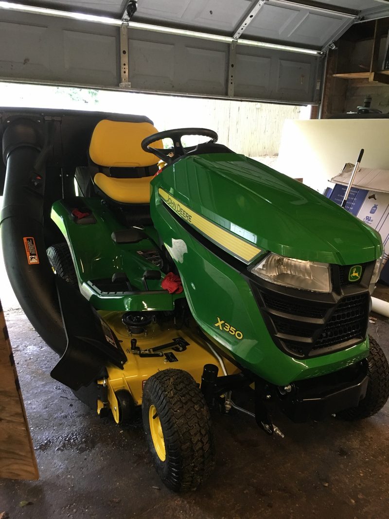 John Deere X350 in a garage.
