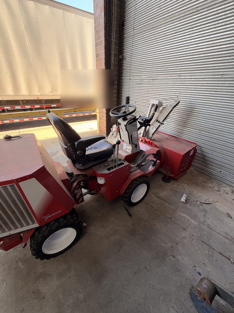 Ventrac 3200 tractor with snowblower at a loading dock.